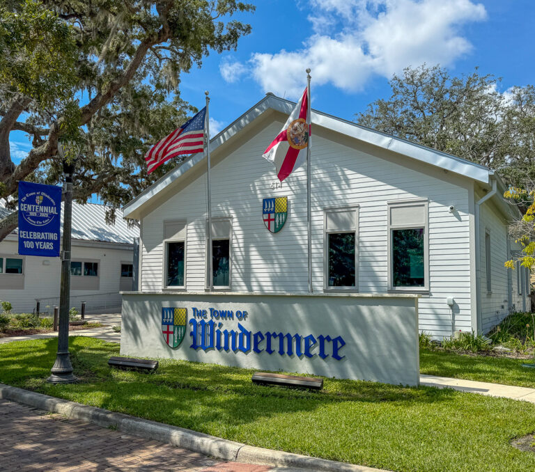 Windermere town hall with usa flags and signage